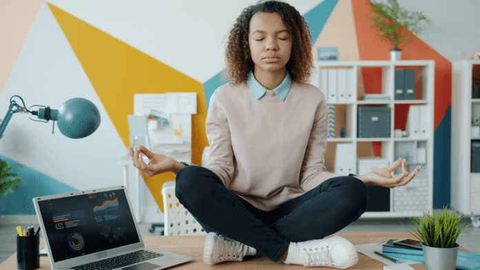 Healthcare professional balancing a wellness career and slow living while working peacefully from a modern workspace.