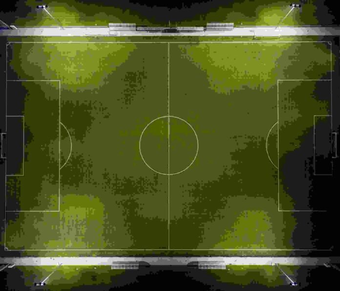 Football match analytics showing live statistics, heat maps, player tracking data, and tactical analysis on multiple digital screens